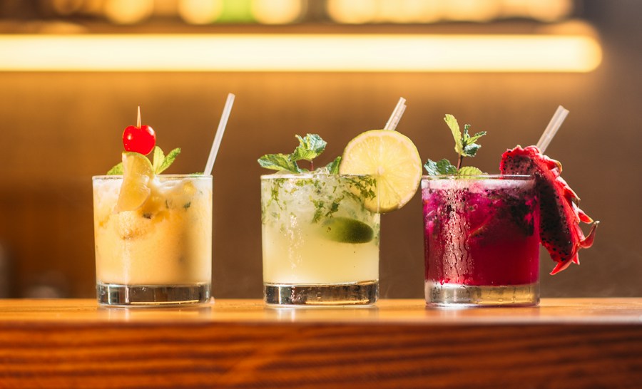 A cocktail with a fresh garnish